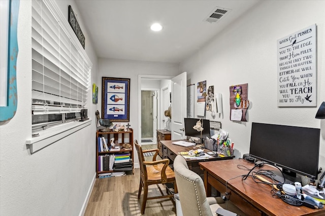 office space with wood-type flooring