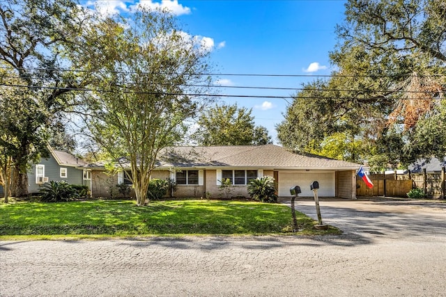 single story home with a front lawn and a garage