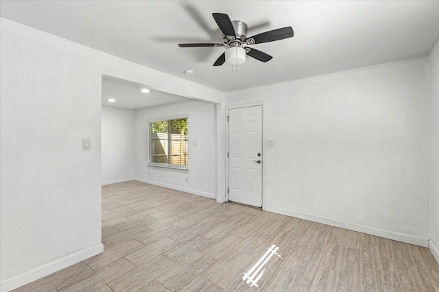 unfurnished room featuring ceiling fan and light hardwood / wood-style flooring