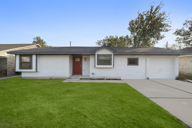 single story home featuring a garage and a front lawn