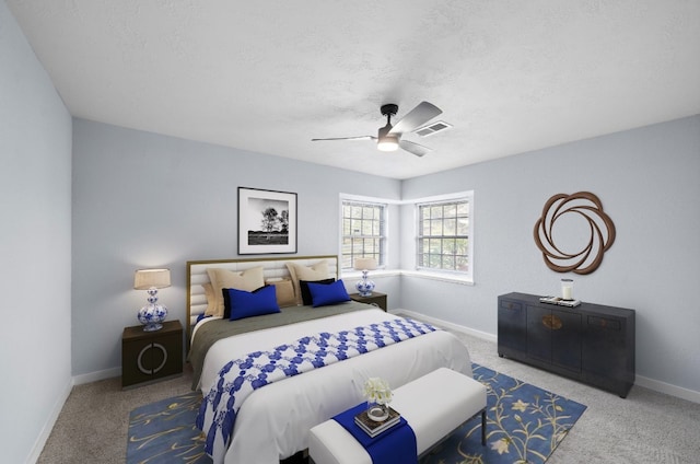 bedroom featuring ceiling fan, a textured ceiling, and carpet floors