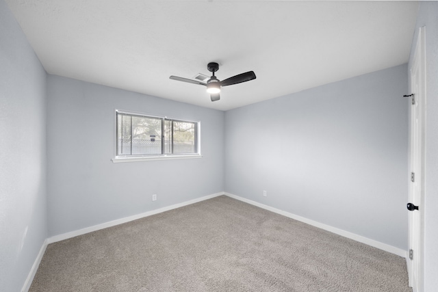 carpeted empty room featuring ceiling fan