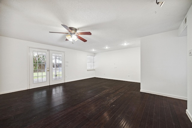 empty room with dark wood-type flooring, french doors, ceiling fan, and a textured ceiling