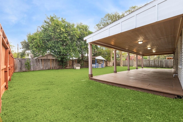 view of yard featuring a wooden deck