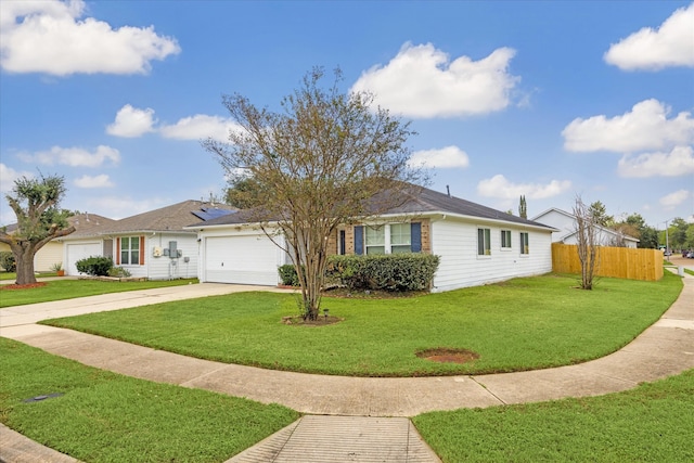 ranch-style home with a garage and a front yard