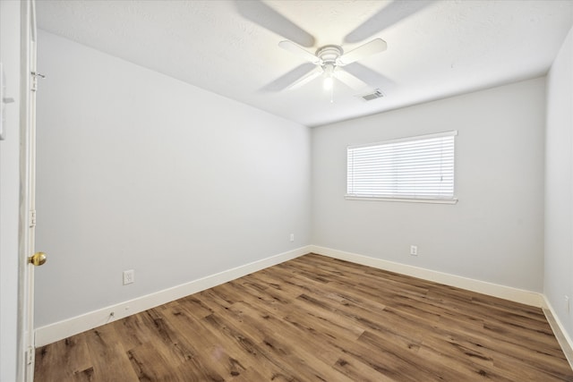 unfurnished room with a textured ceiling, hardwood / wood-style flooring, and ceiling fan