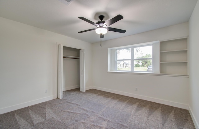 unfurnished bedroom with light carpet, ceiling fan, and a closet