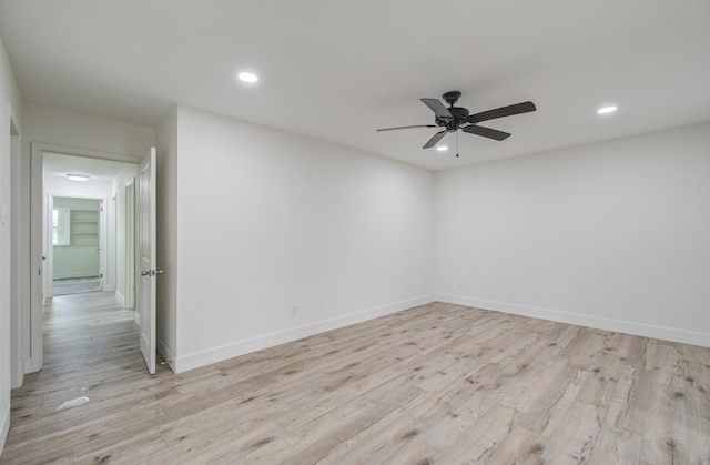 empty room featuring light hardwood / wood-style flooring and ceiling fan