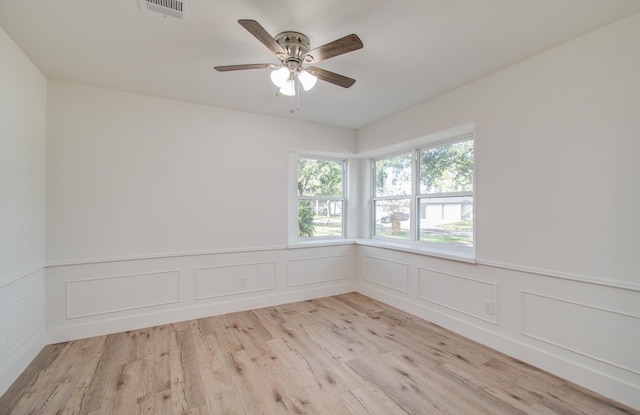 unfurnished room featuring light wood-type flooring and ceiling fan