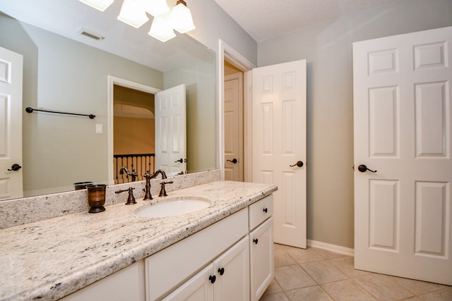 bathroom with vanity and tile patterned floors