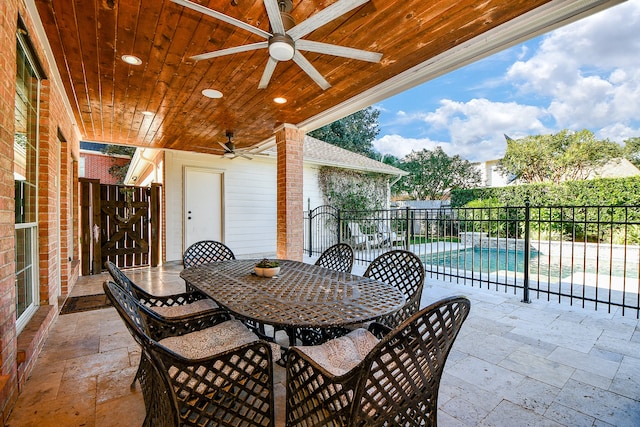 view of patio with a fenced in pool