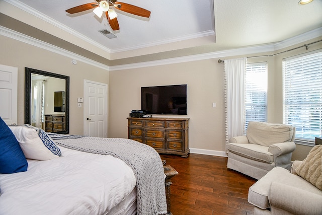 bedroom with ornamental molding, ceiling fan, and dark wood-type flooring