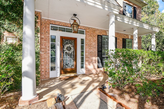 entrance to property featuring covered porch