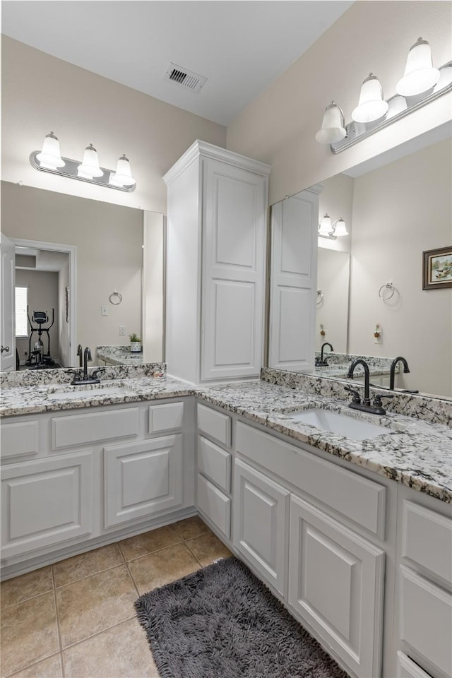 bathroom featuring tile patterned floors and vanity