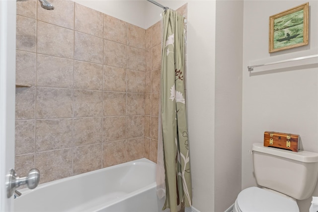 bathroom featuring toilet and shower / bath combo with shower curtain