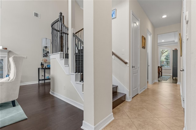 hall featuring light tile patterned flooring