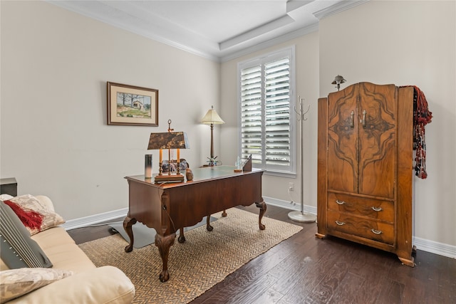 office space with a tray ceiling, crown molding, plenty of natural light, and dark wood-type flooring