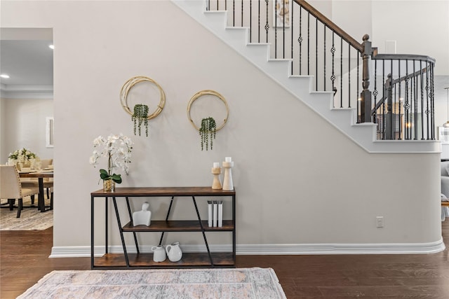 staircase with wood-type flooring