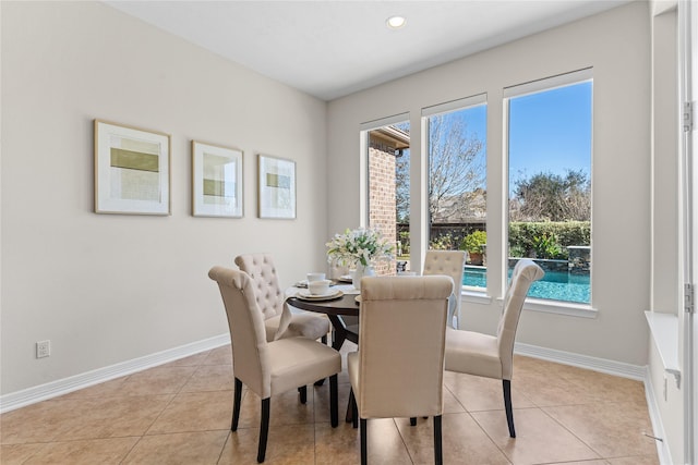 dining space featuring light tile patterned floors