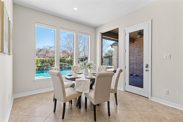 dining area featuring ceiling fan and light tile patterned floors