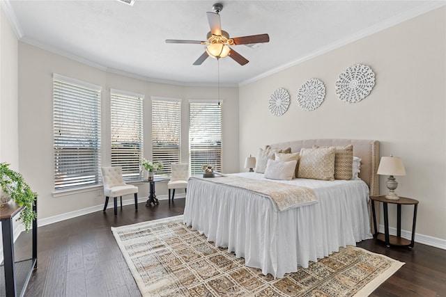 bedroom featuring dark hardwood / wood-style floors, ceiling fan, and ornamental molding