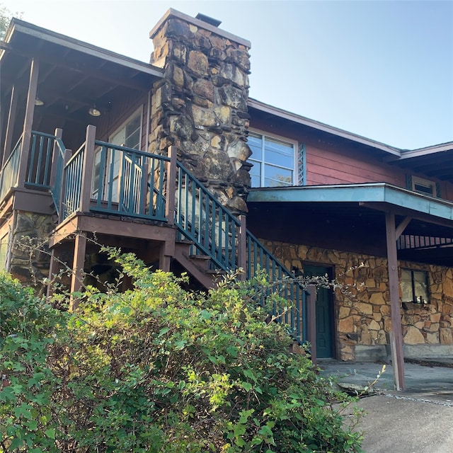 view of property exterior with a patio area