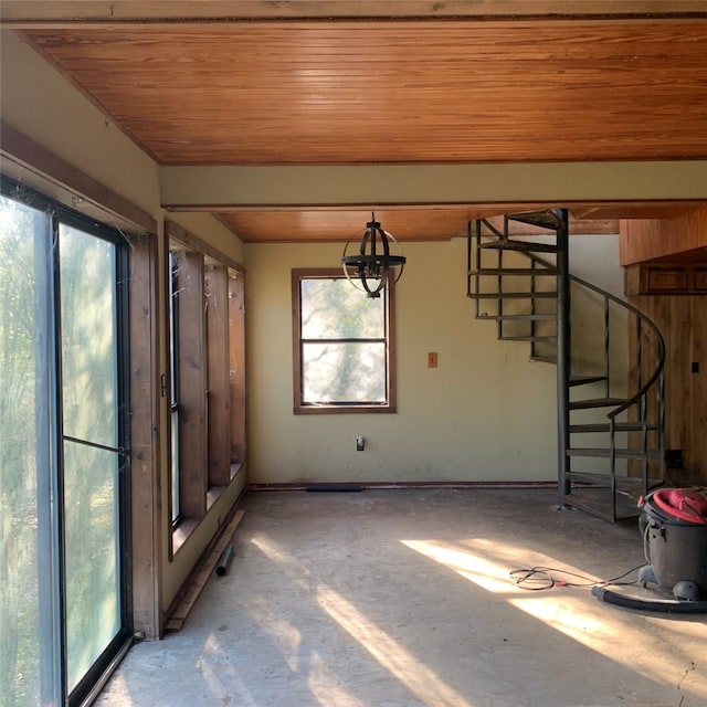 unfurnished sunroom featuring wooden ceiling