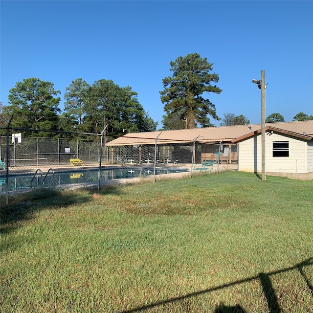 view of yard with a fenced in pool