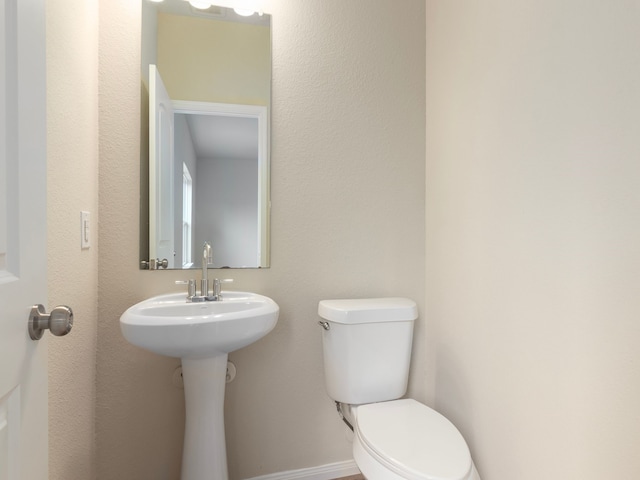 bathroom featuring toilet