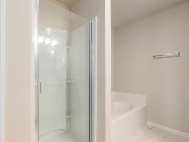 bathroom featuring plus walk in shower