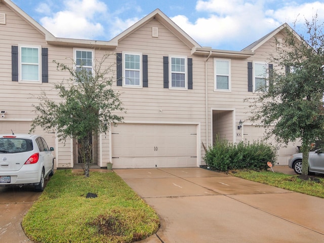 multi unit property featuring a garage