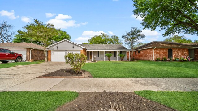 ranch-style house featuring a garage and a front yard