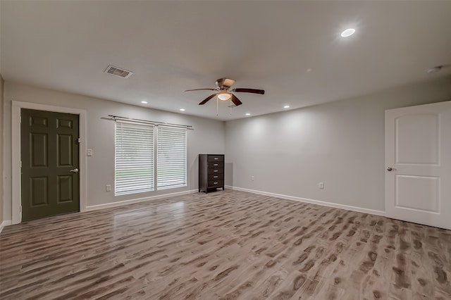 unfurnished living room with light hardwood / wood-style flooring and ceiling fan