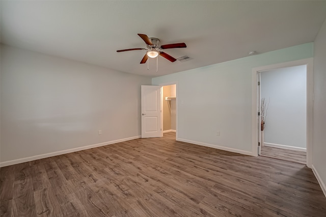 spare room with wood-type flooring and ceiling fan