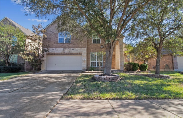 view of front of home featuring a garage and a front yard