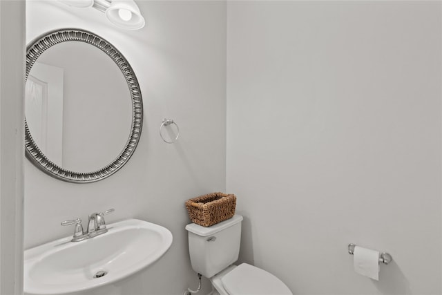 bathroom with sink and toilet