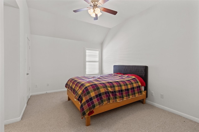 carpeted bedroom with ceiling fan and lofted ceiling