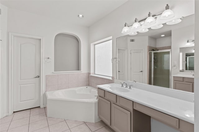 bathroom with separate shower and tub, tile patterned flooring, and vanity