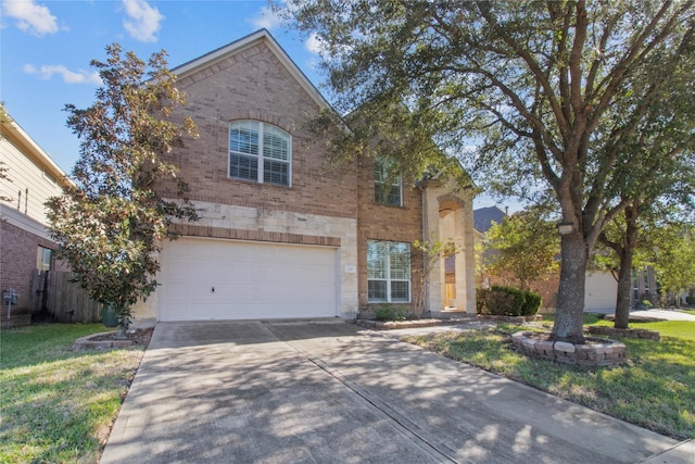 view of front of home featuring a garage and a front yard