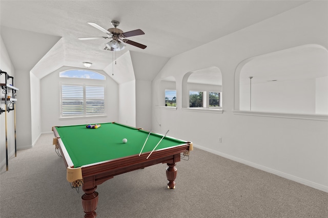 rec room with carpet, vaulted ceiling, ceiling fan, and plenty of natural light