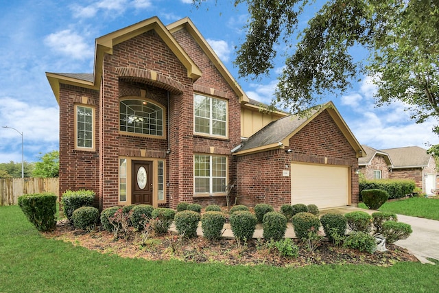 view of front of home featuring a front lawn and a garage