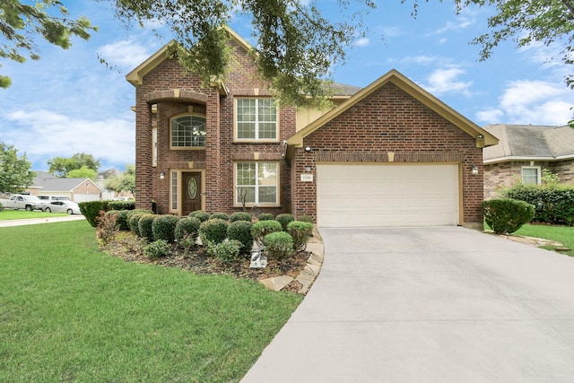 view of front of property with a front yard and a garage