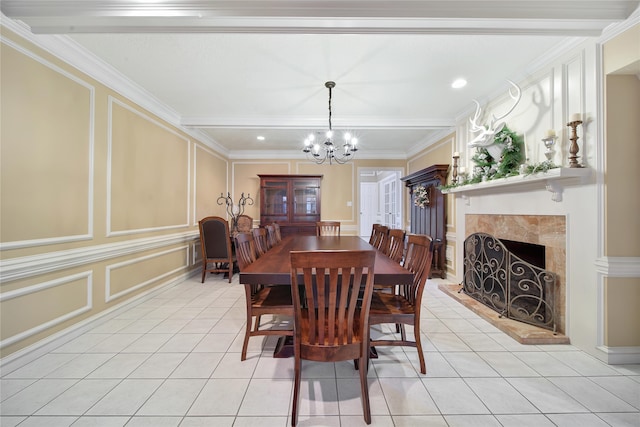 tiled dining space with an inviting chandelier and ornamental molding