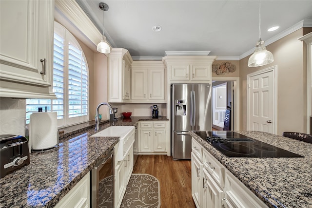 kitchen with black electric cooktop, wine cooler, dark hardwood / wood-style floors, stainless steel fridge with ice dispenser, and pendant lighting