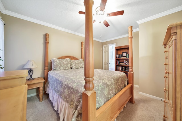 bedroom featuring a textured ceiling, light colored carpet, ceiling fan, and crown molding