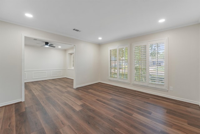 spare room featuring ceiling fan, dark hardwood / wood-style flooring, and ornamental molding