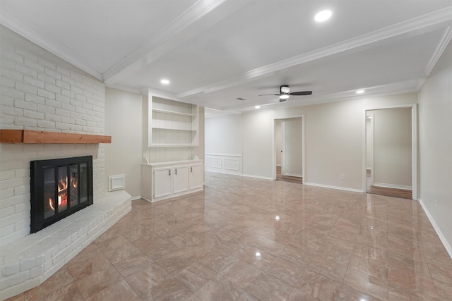 unfurnished living room featuring built in shelves, ceiling fan, crown molding, and a fireplace