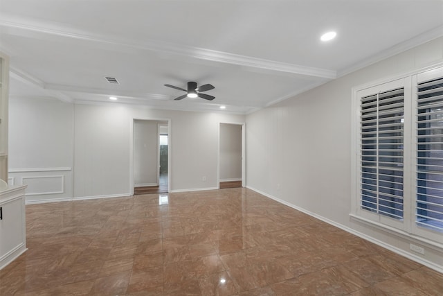 spare room with ceiling fan and crown molding