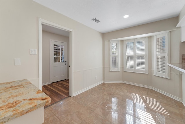 unfurnished dining area with light wood-type flooring