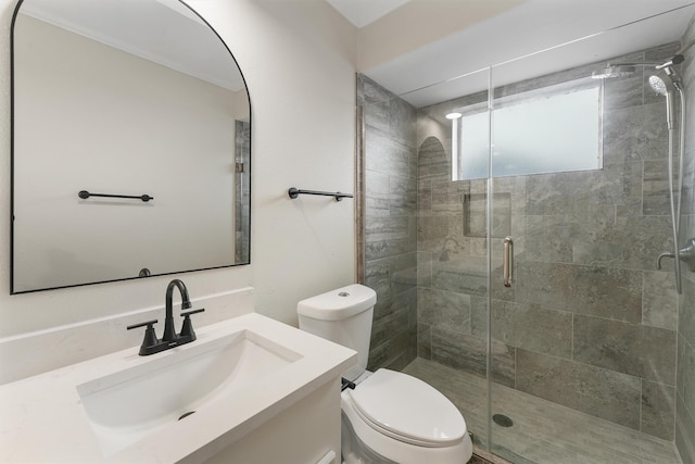 bathroom featuring vanity, toilet, and walk in shower